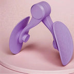Purple adjustable thigh exerciser with textured foot pedals on a pink background