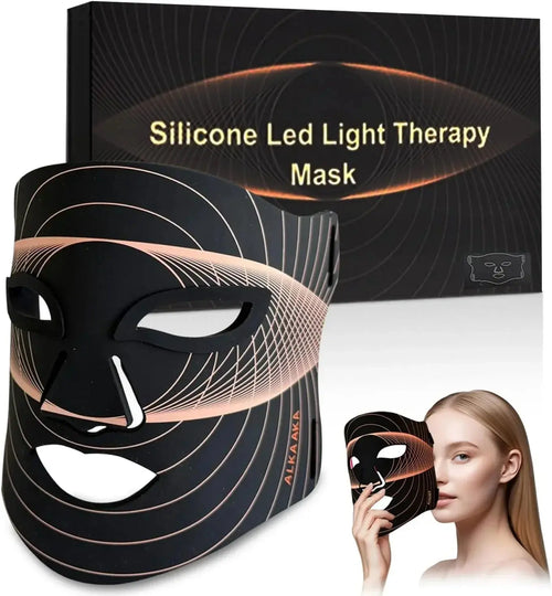Silicone LED light therapy mask in black with geometric patterns, shown with product box and model holding mask to face