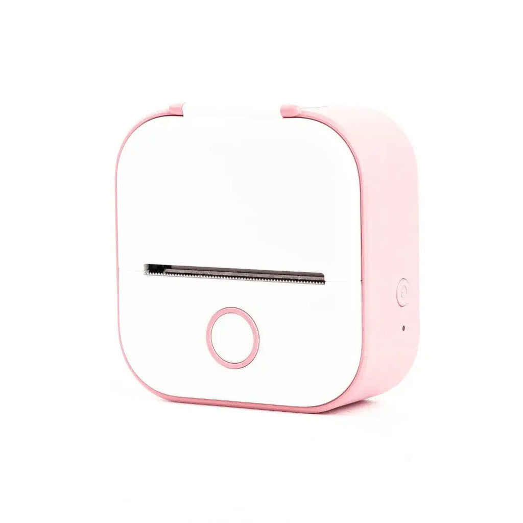 Compact pink and white portable label printer with front circular button, isolated on white