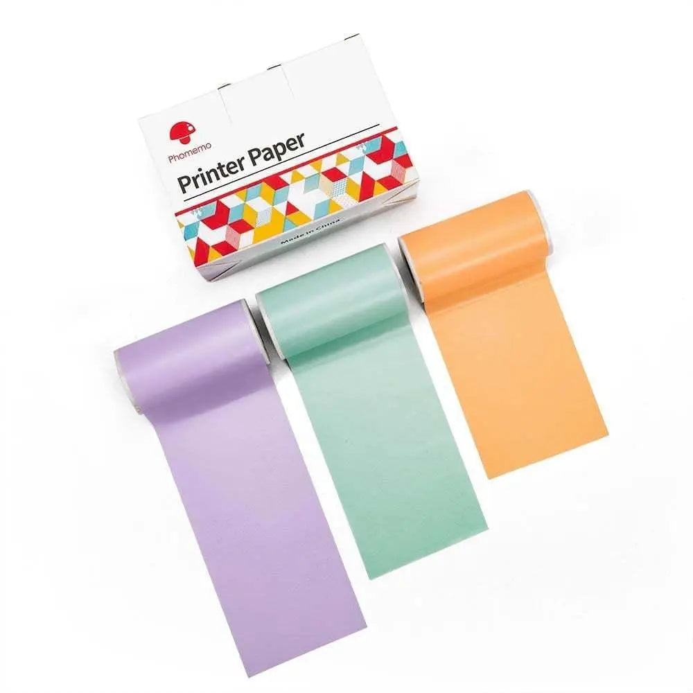Colorful printer paper rolls in purple, green, and orange with packaging box